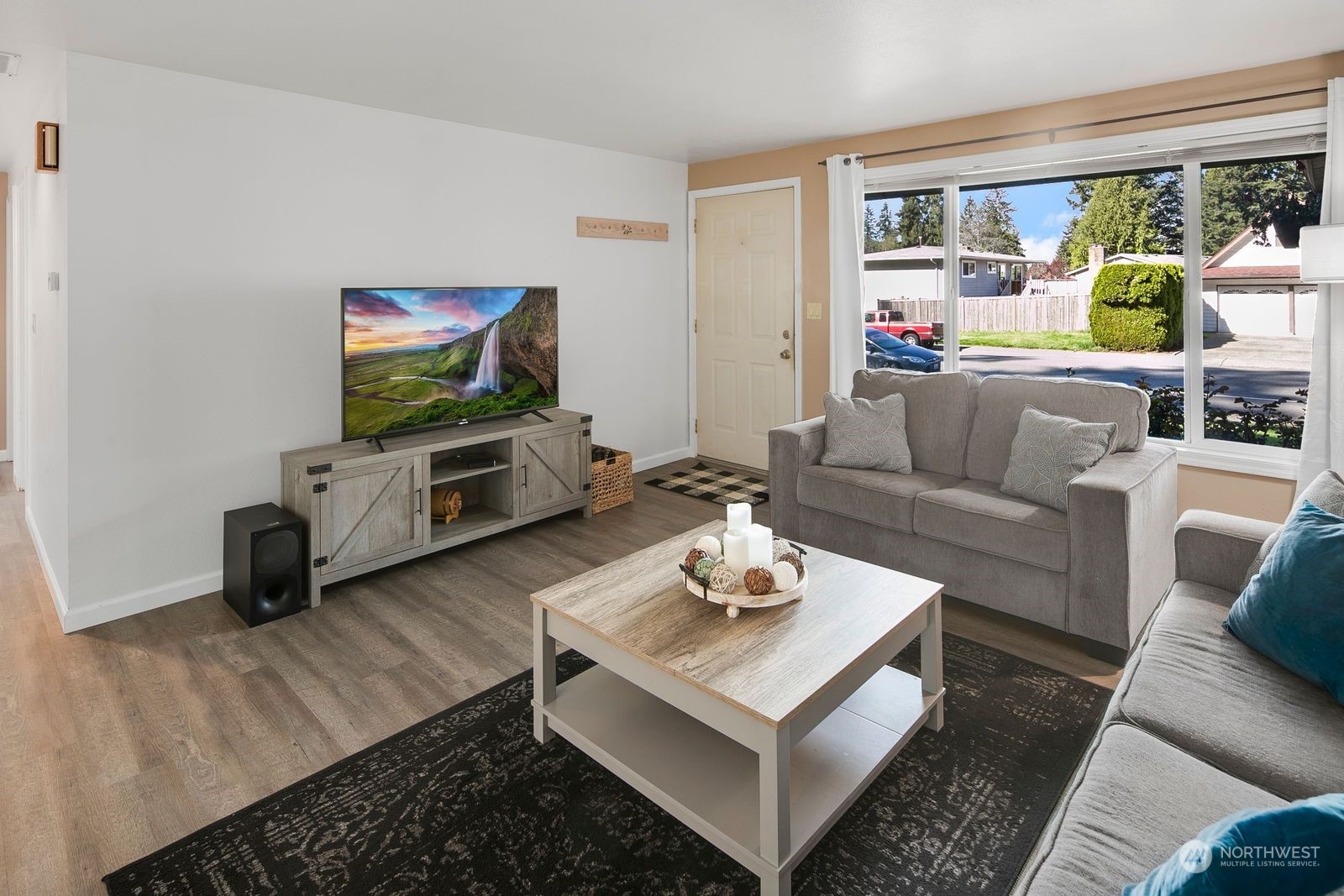 15612 119th Avenue Northeast Bothell, WA 98011 - Photo 7 of 32 a living room with furniture and a flat screen tv