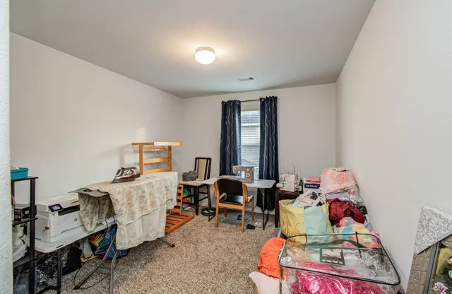 a room with furniture toys and a large window