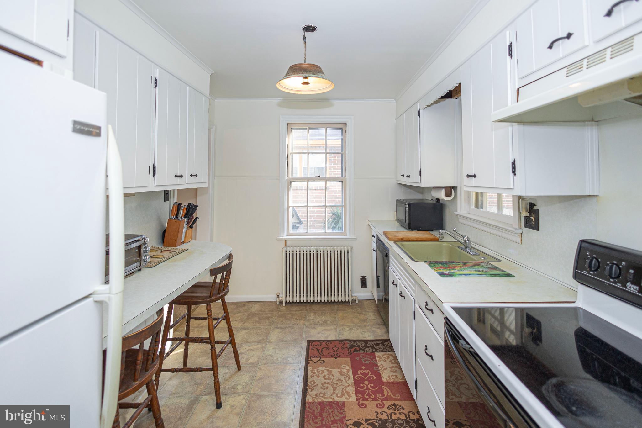 1420 Prospect Ridge Boulevard Haddon Heights, NJ 08035 - Photo 11 of 29 a kitchen that has a lot of cabinets in it and wooden floors
