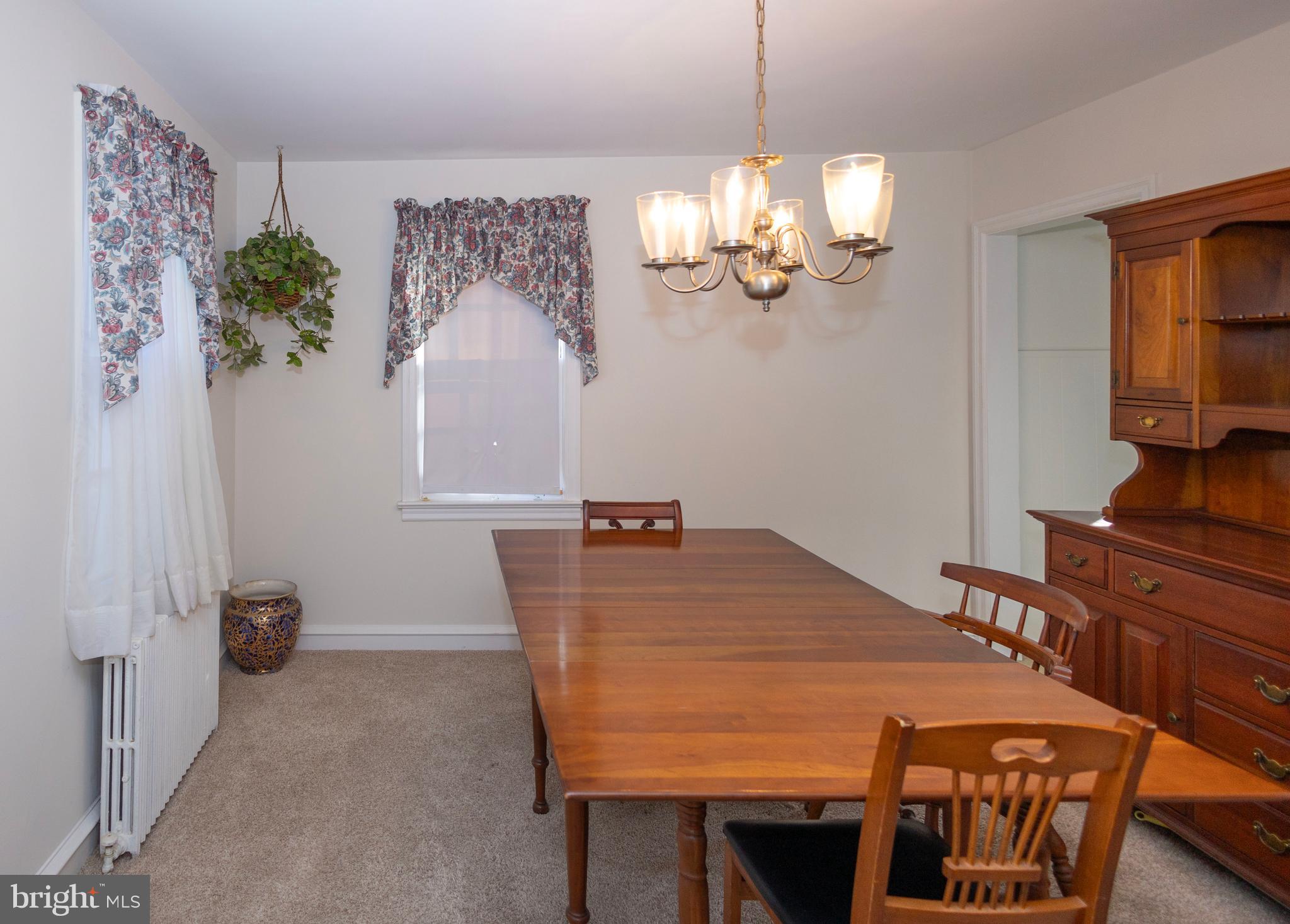 1420 Prospect Ridge Boulevard Haddon Heights, NJ 08035 - Photo 6 of 29 a view of a dining room with furniture a chandelier and wooden floor