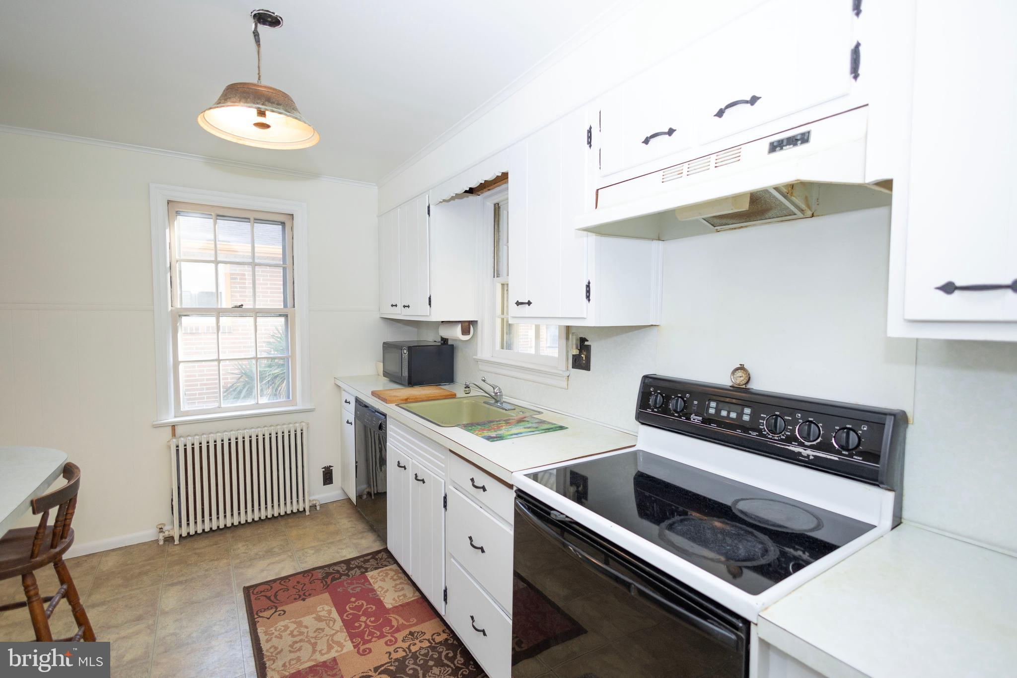 1420 Prospect Ridge Boulevard Haddon Heights, NJ 08035 - Photo 10 of 29 a kitchen that has a stove and a wooden floor