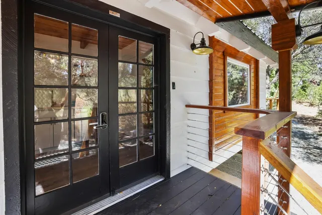 a view of front door of house with wooden floor