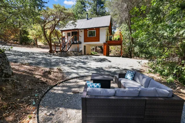 a view of house with yard