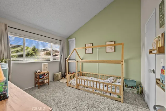 a view of a hallway to room with stair