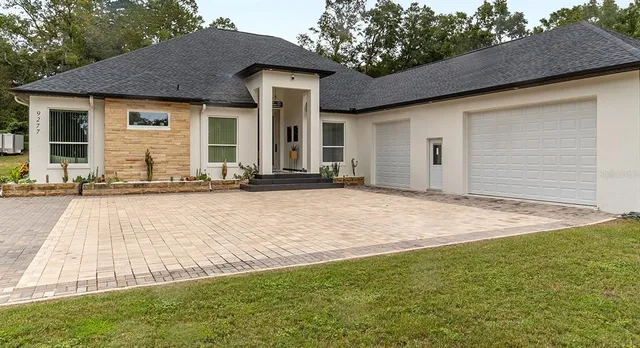 a front view of a house with a yard