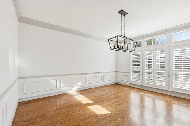 a view of a room with rack on the wall and a window