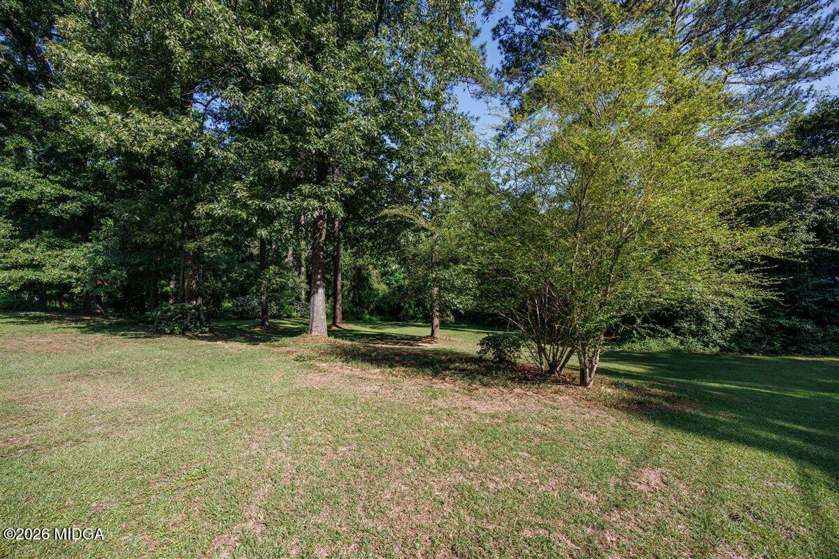 335 Hamrick Road Macon, GA 31220 - Photo 39 of 41 a view of a field with trees in the background