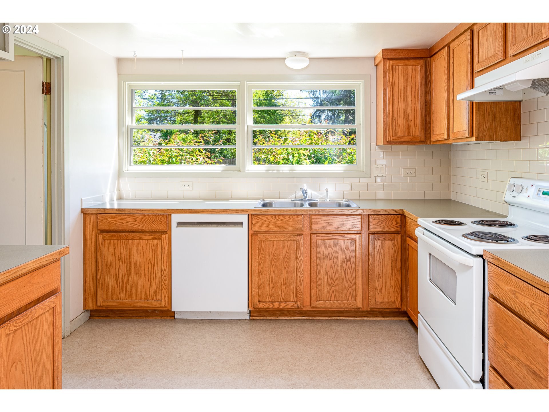 2915 Mill Street Eugene, OR 97405 - Photo 12 of 37 a kitchen with a sink and a stove