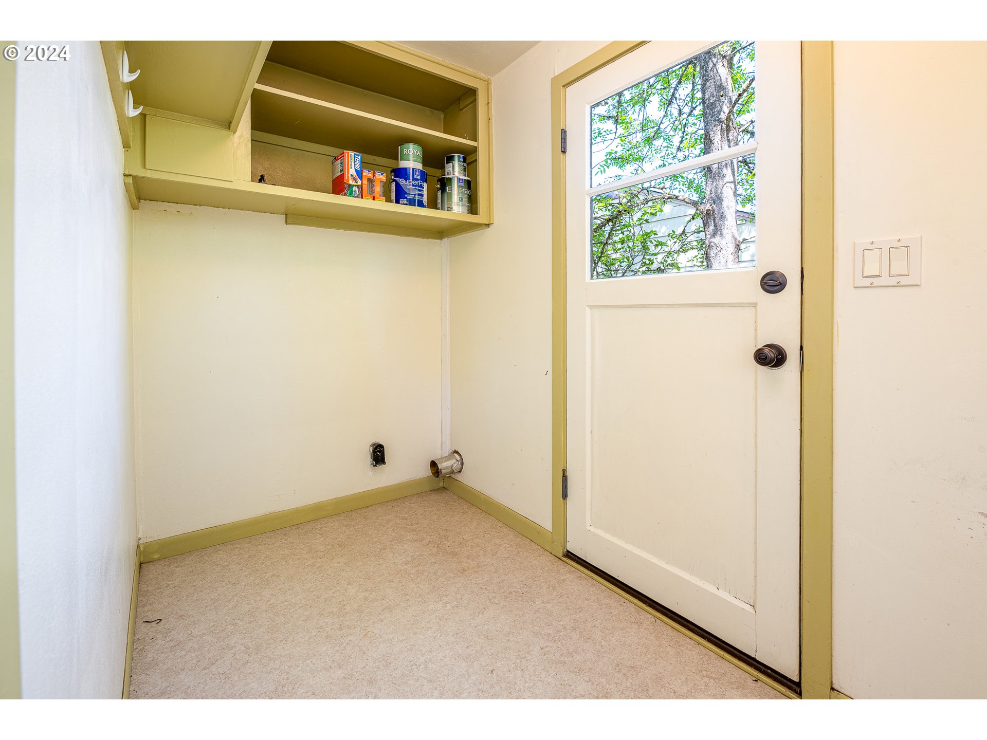 2915 Mill Street Eugene, OR 97405 - Photo 18 of 37 a view of a refrigerator in a kitchen and a window