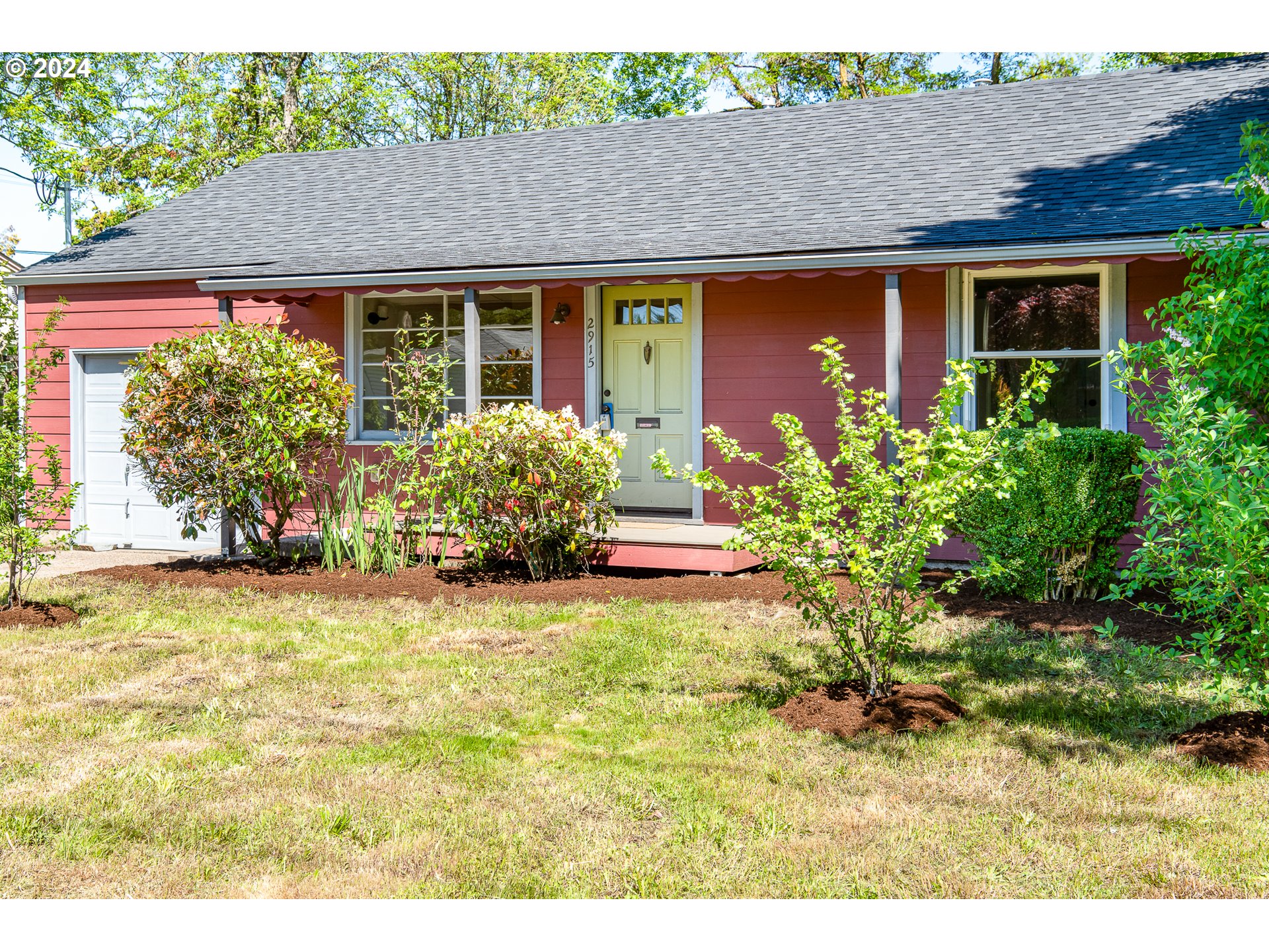 2915 Mill Street Eugene, OR 97405 - Photo 2 of 37 a front view of a house with garden