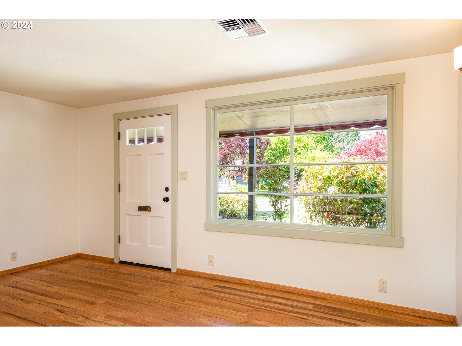 2915 Mill Street Eugene, OR 97405 - Photo 6 of 37 a view of an empty room with a window