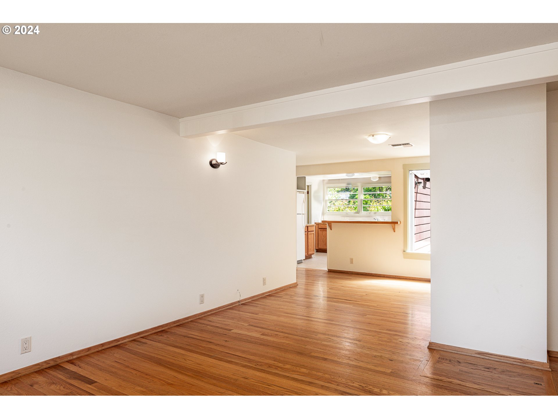2915 Mill Street Eugene, OR 97405 - Photo 9 of 37 a view of an empty room and wooden floor