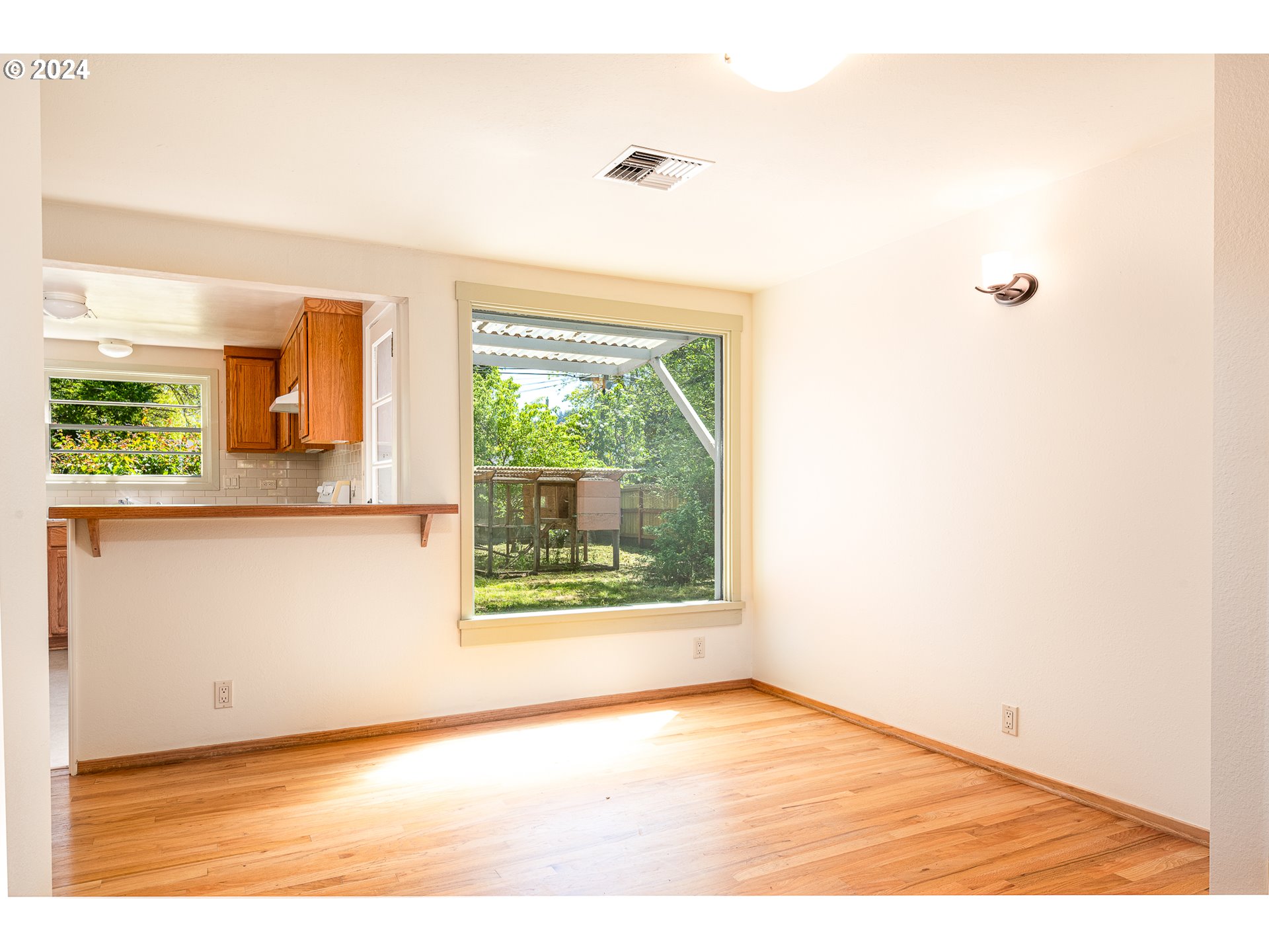 2915 Mill Street Eugene, OR 97405 - Photo 10 of 37 a view of an empty room with a window