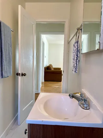 a bathroom with a sink and a mirror