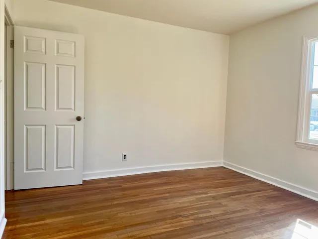 a kitchen with stainless steel appliances kitchen island granite countertop a stove a sink and a refrigerator