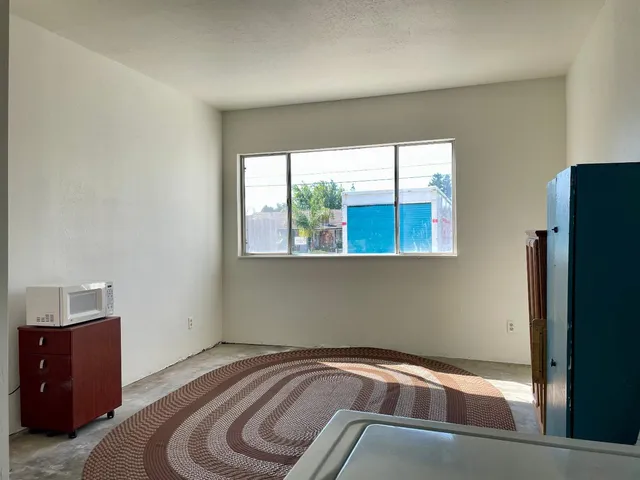 a bedroom with a bed and a closet