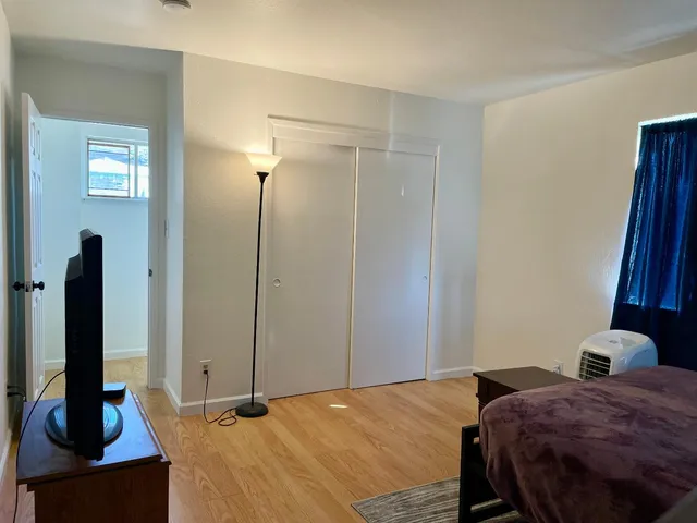 a backyard of a house with table and chair