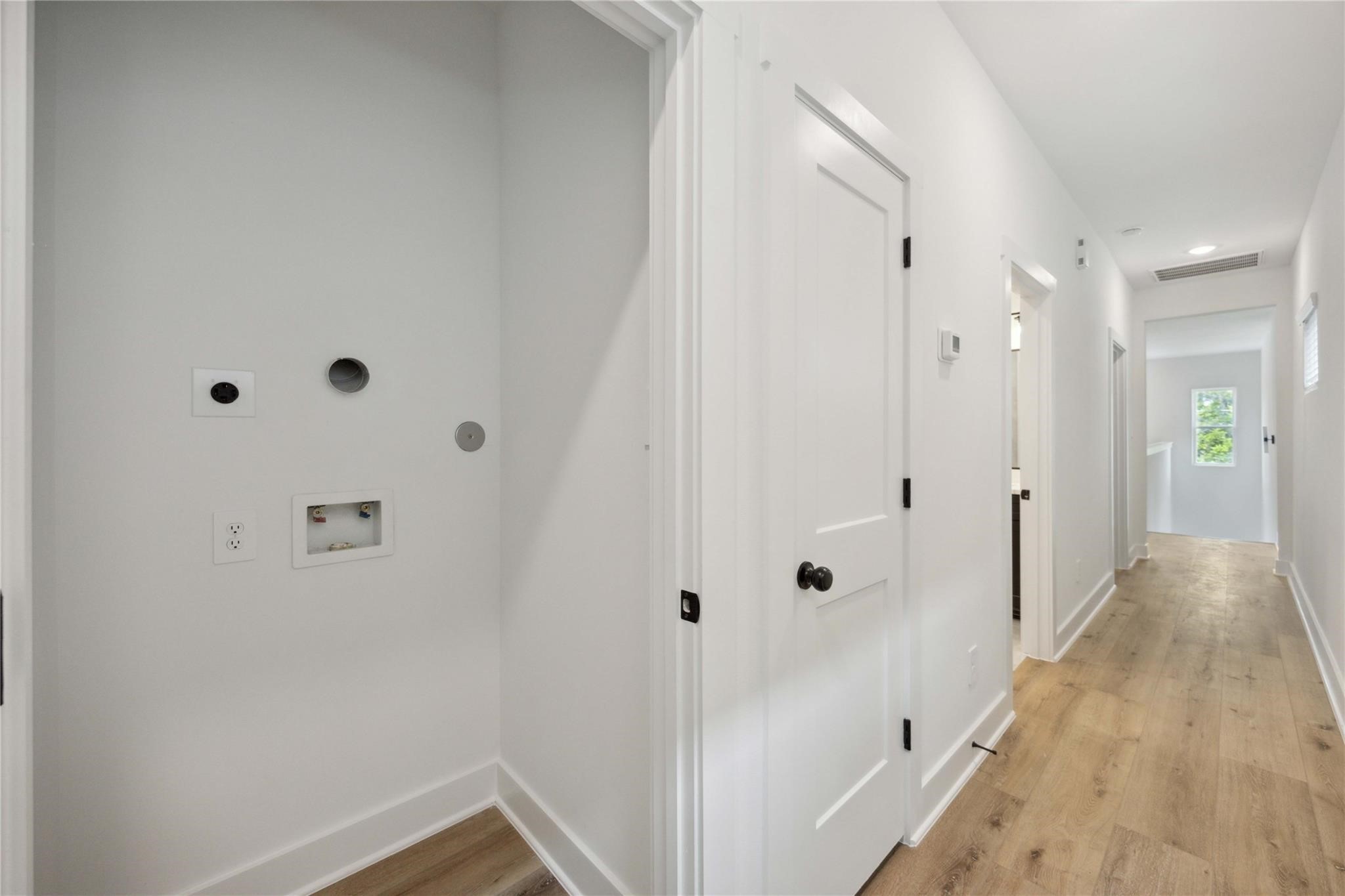 8017 A Cora Street Houston, TX 77088 - Photo 20 of 29 a view of a hallway with wooden door