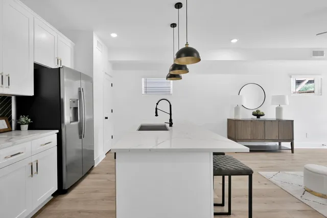 a kitchen with a stove and a microwave