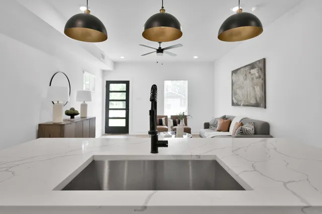a view of a hallway with wooden floor and a window