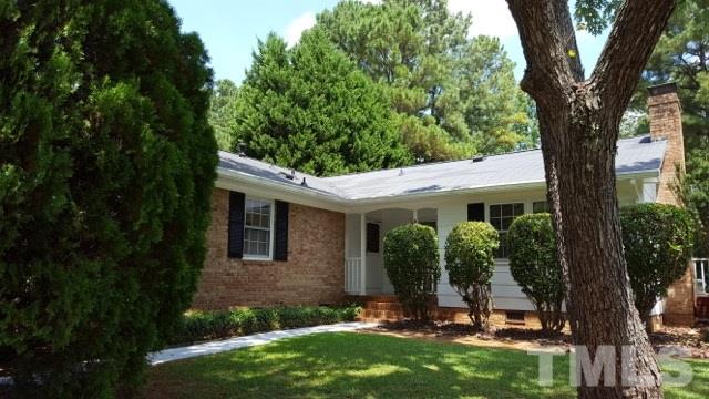 6500 Keystone Drive Raleigh, NC 27612 - Photo 1 of 15 a view of a house with backyard and a tree
