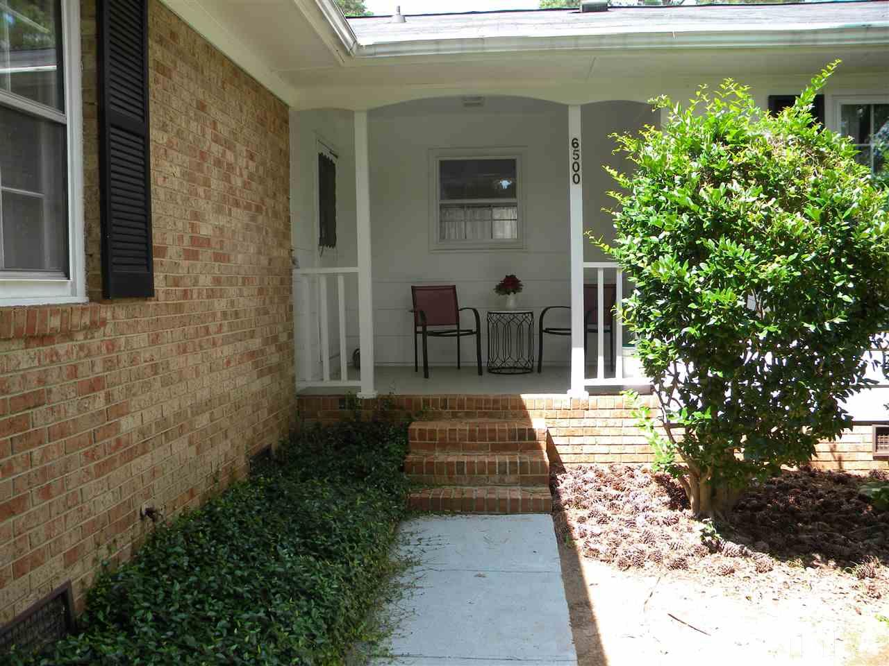 6500 Keystone Drive Raleigh, NC 27612 - Photo 2 of 15 a front view of a house with a yard