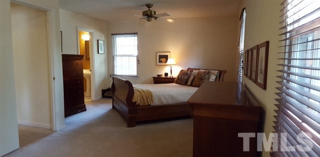 6500 Keystone Drive Raleigh, NC 27612 - Photo 11 of 15 a spacious bedroom with a bed and window