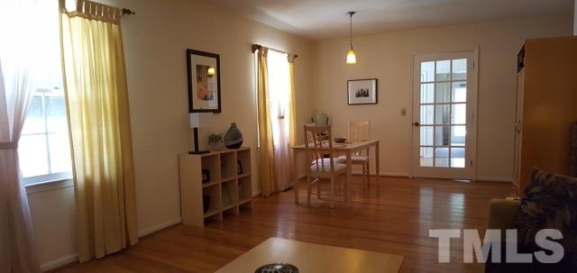 6500 Keystone Drive Raleigh, NC 27612 - Photo 4 of 15 a view of a livingroom with furniture hardwood floor and a window
