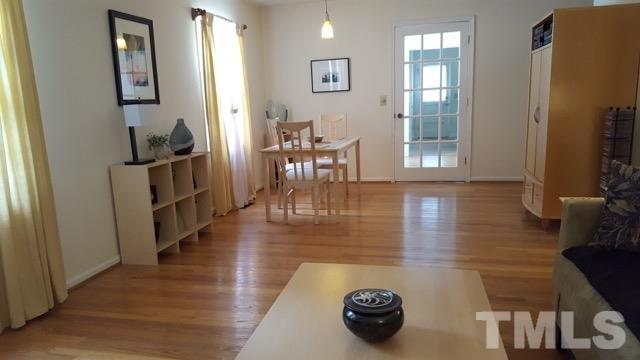6500 Keystone Drive Raleigh, NC 27612 - Photo 6 of 15 a view of a dining room with furniture and wooden floor