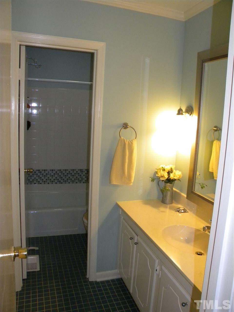 6500 Keystone Drive Raleigh, NC 27612 - Photo 10 of 15 a bathroom with a sink and mirror