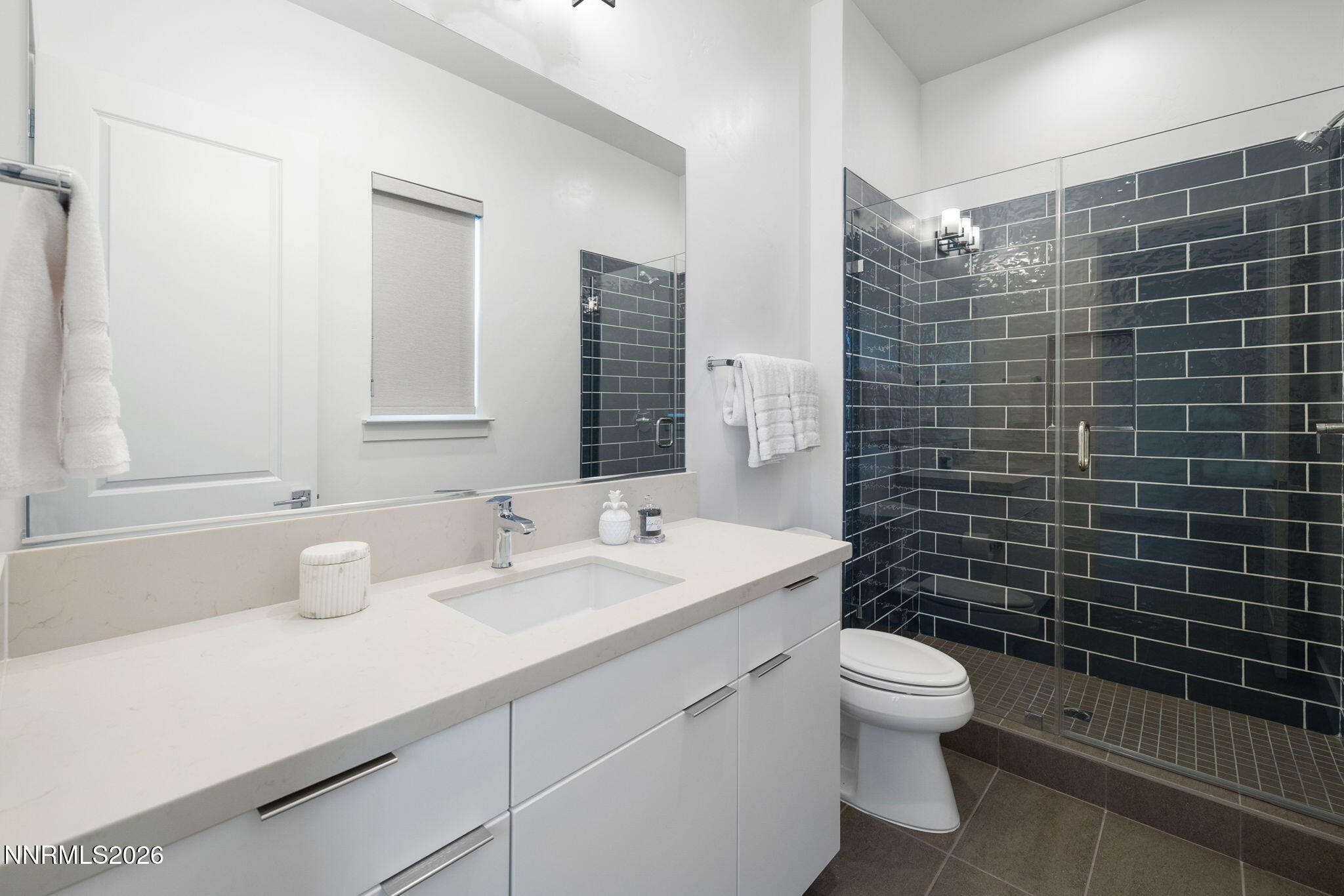 5406 Side Saddle Trail Reno, NV 89511 - Photo 15 of 39 a bathroom with a double vanity sink toilet and mirror