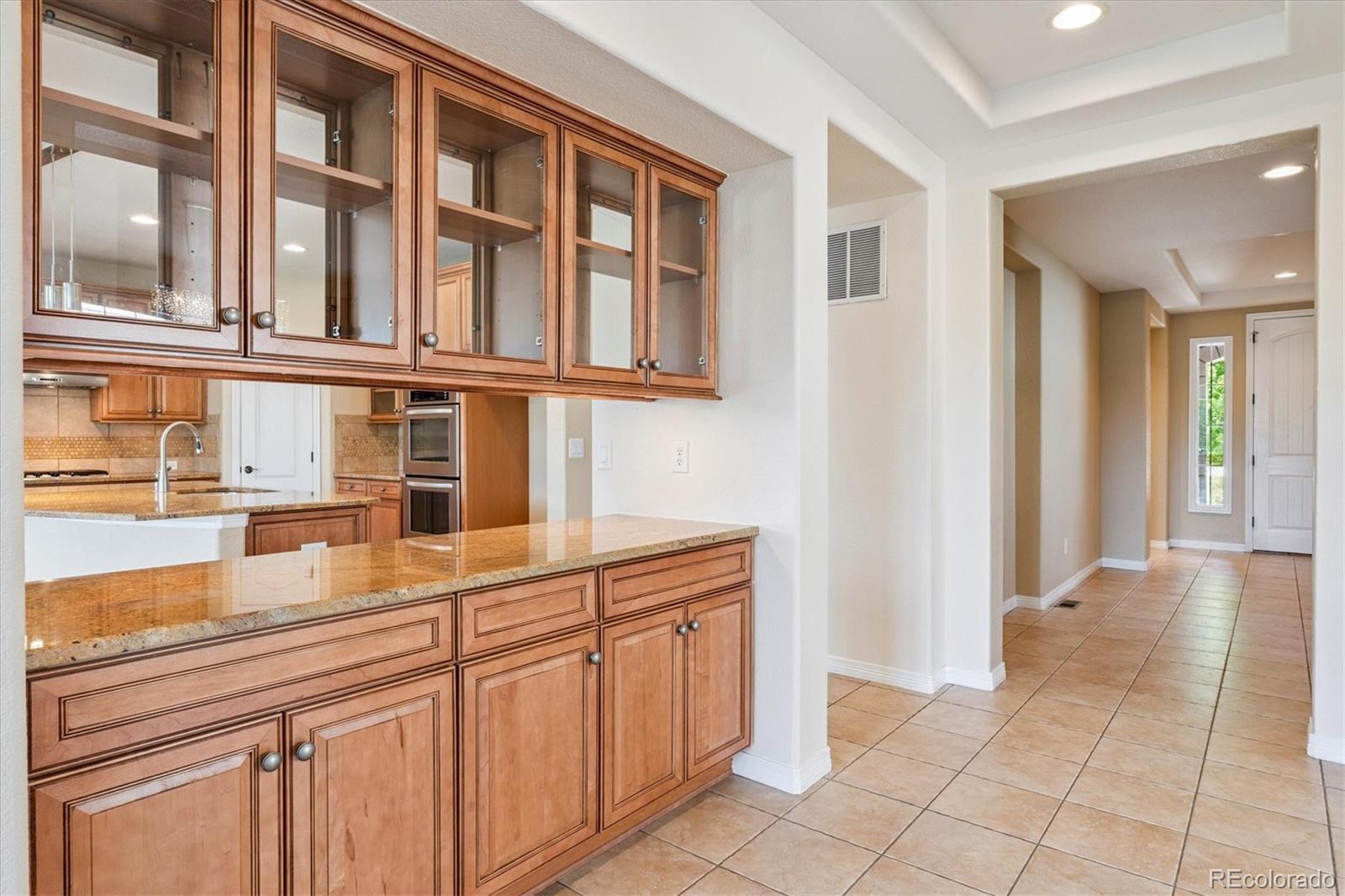 10426 Willowwisp Way Highlands Ranch, CO 80126 - Photo 12 of 47 a view of a kitchen with a sink and cabinets