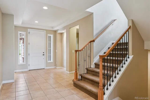 a view of an entryway with wooden floor