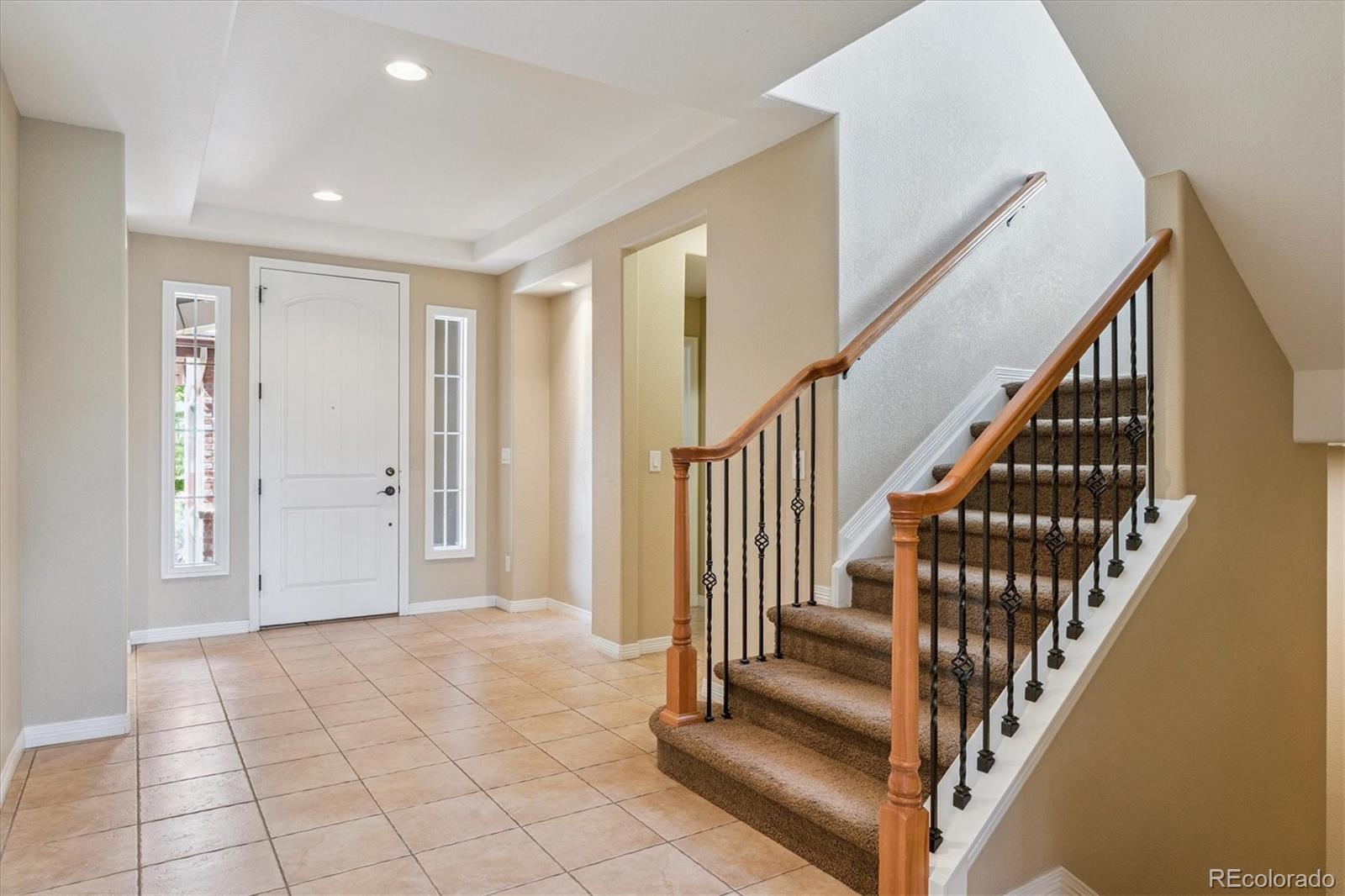 10426 Willowwisp Way Highlands Ranch, CO 80126 - Photo 3 of 47 a view of an entryway with wooden floor