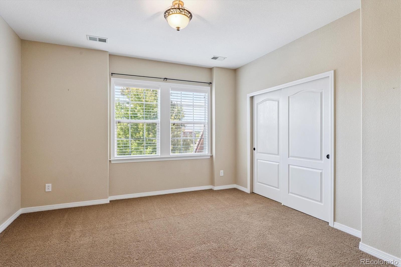 10426 Willowwisp Way Highlands Ranch, CO 80126 - Photo 31 of 47 a view of an empty room with a window