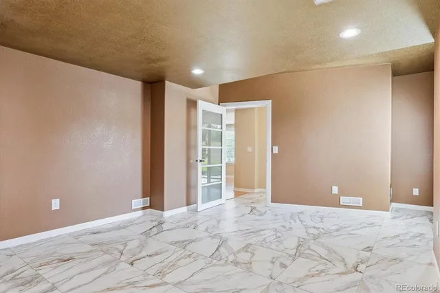 a view of a livingroom with wooden floor and cabinet