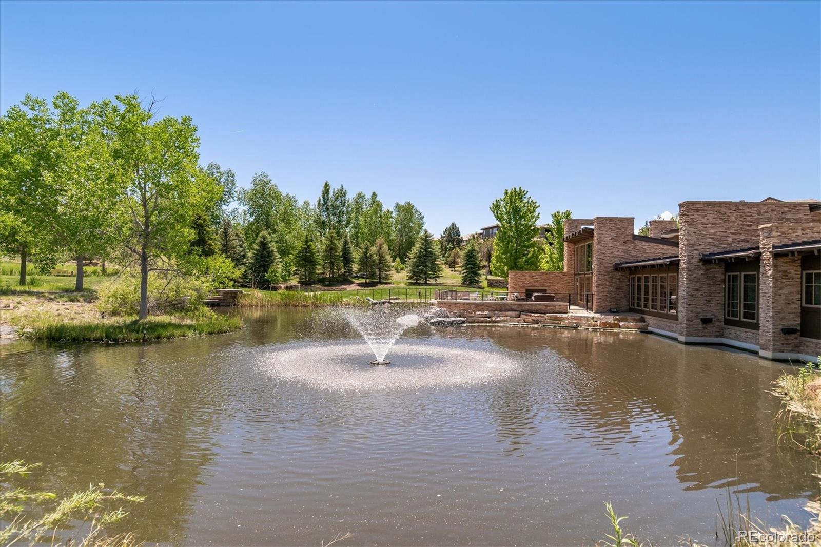10426 Willowwisp Way Highlands Ranch, CO 80126 - Photo 45 of 47 a view of a lake with houses