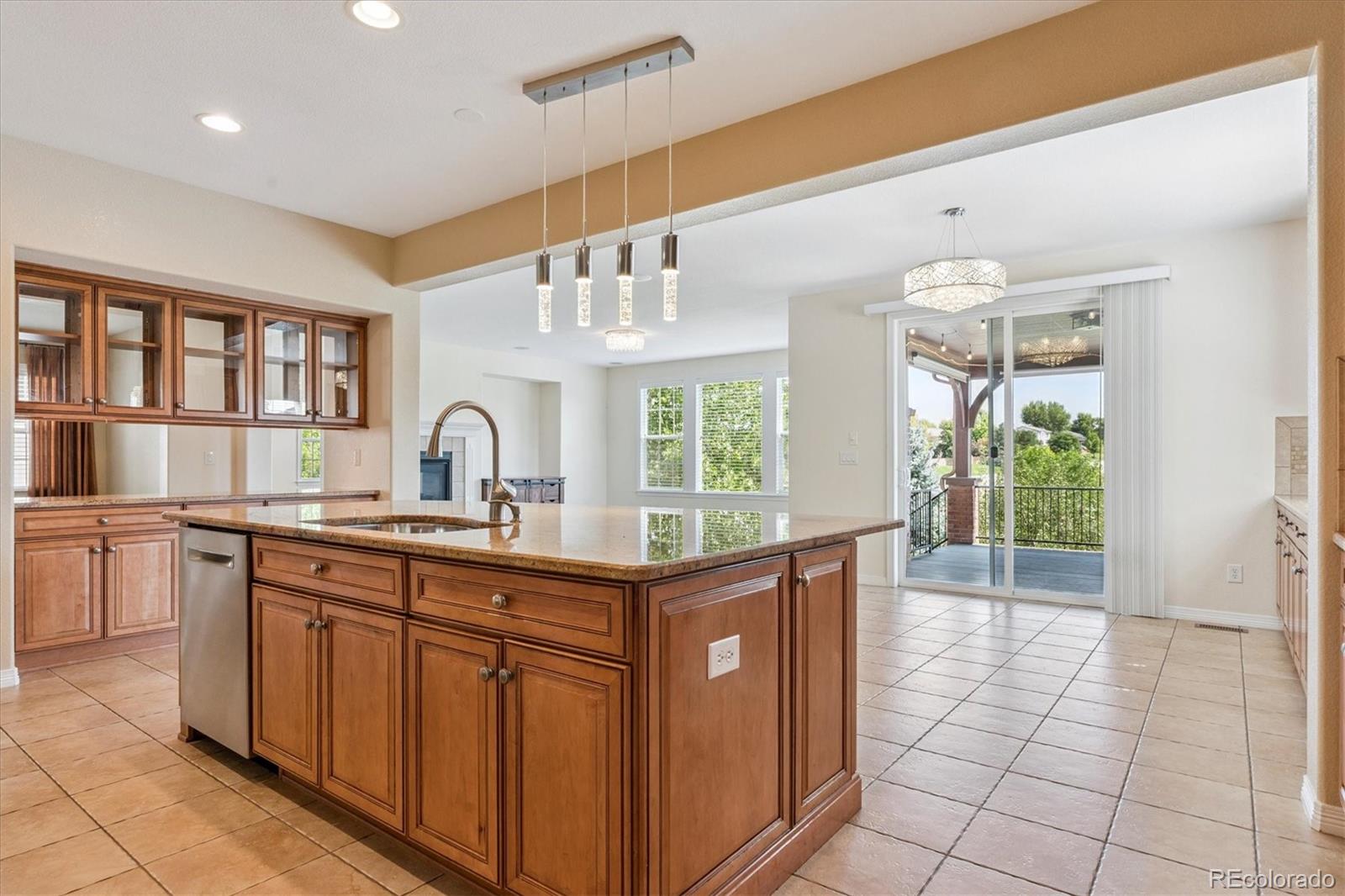 10426 Willowwisp Way Highlands Ranch, CO 80126 - Photo 8 of 47 a kitchen with a sink window and cabinets