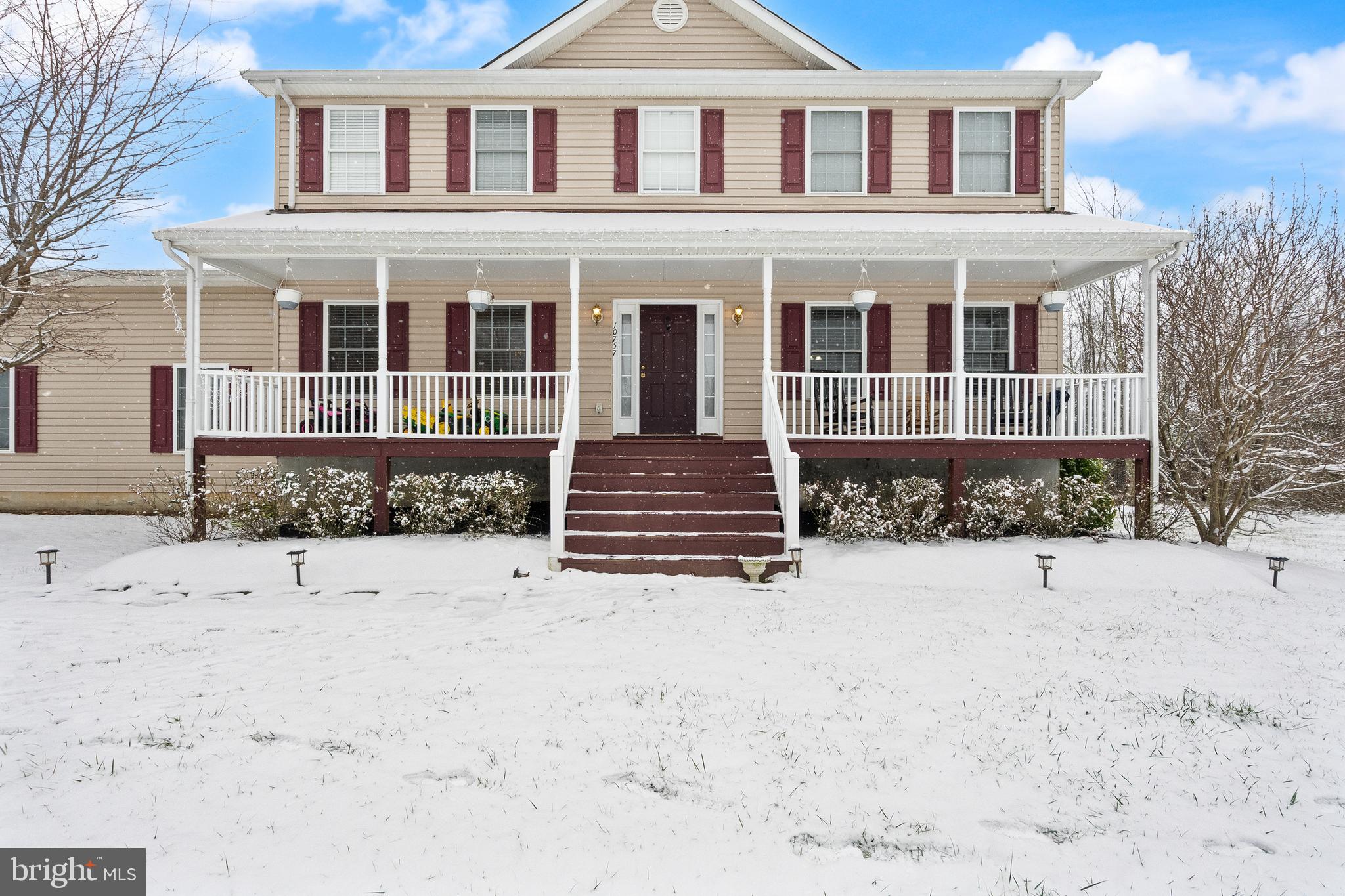 10757 Shenandoah Path Catlett, VA 20119 - Photo 1 of 55 a front view of a house with a yard covered in snow