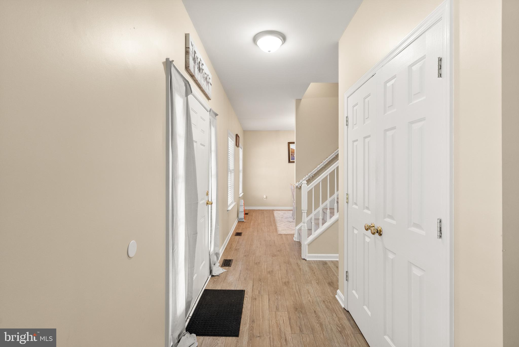 10757 Shenandoah Path Catlett, VA 20119 - Photo 15 of 55 a view of a hallway with wooden floor and staircase