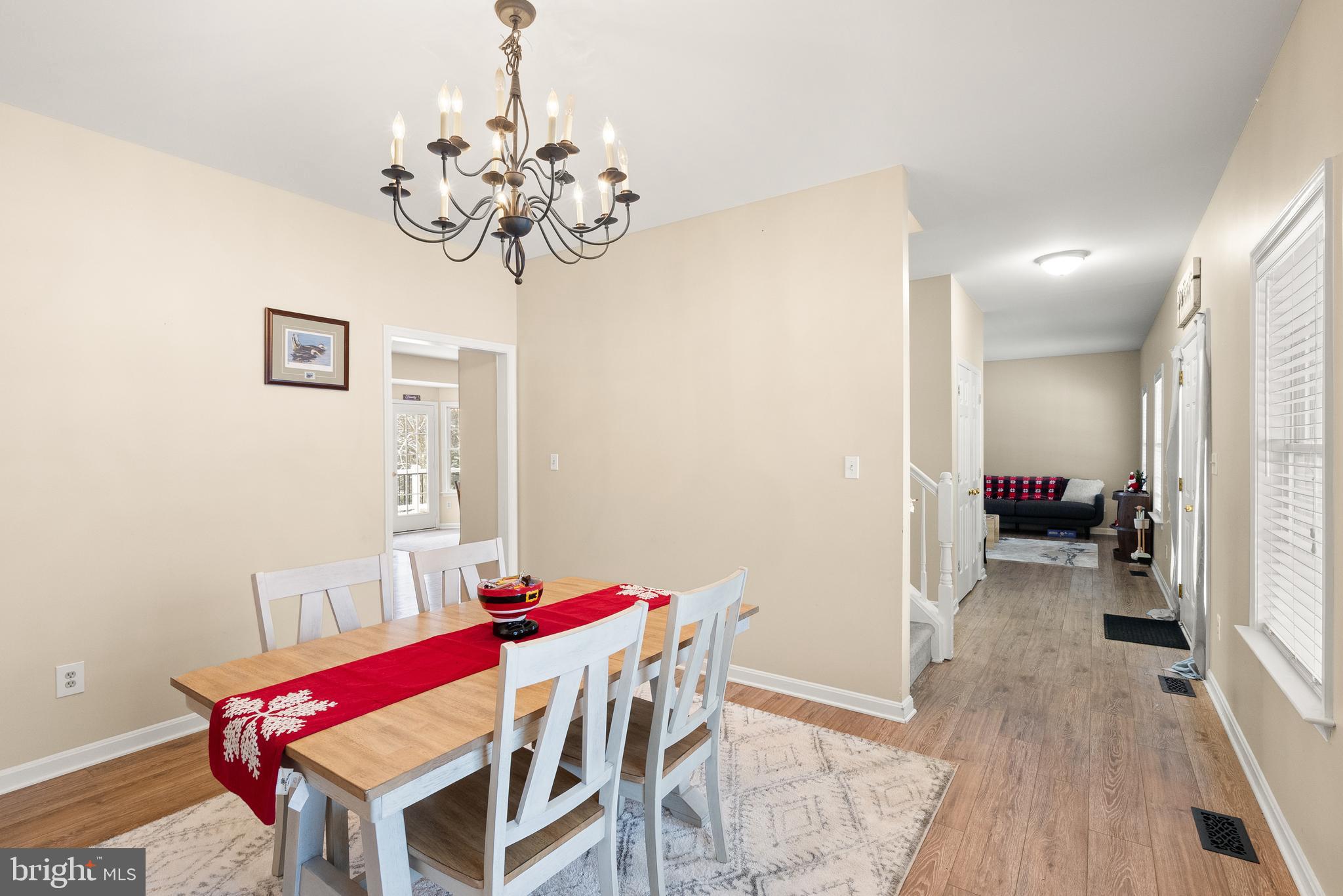 10757 Shenandoah Path Catlett, VA 20119 - Photo 18 of 55 a view of a dining room with furniture and wooden floor