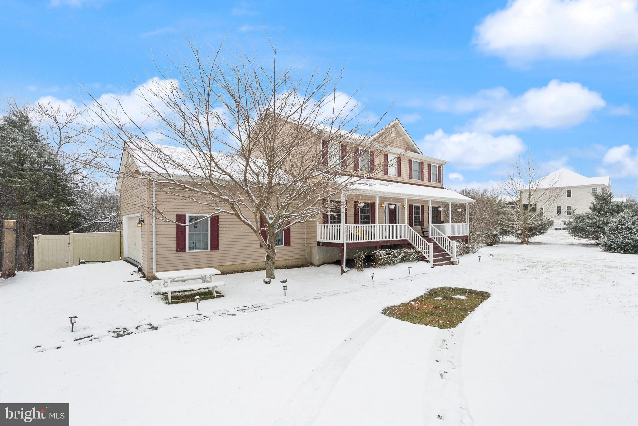 10757 Shenandoah Path Catlett, VA 20119 - Photo 2 of 55 a view of a white house with a yard covered in snow