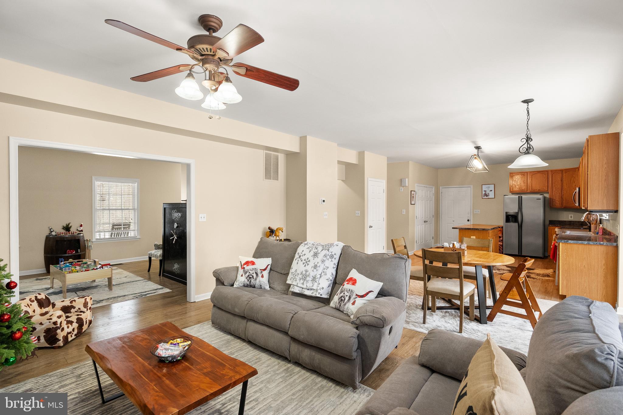 10757 Shenandoah Path Catlett, VA 20119 - Photo 24 of 55 a living room with furniture kitchen view and a chandelier