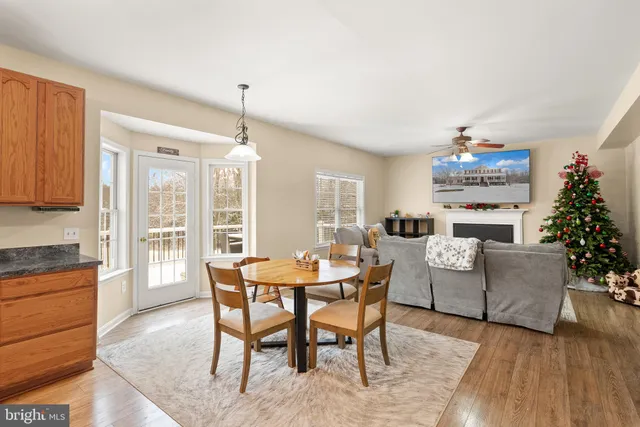 a view of a dining area with furniture window and wooden floor
