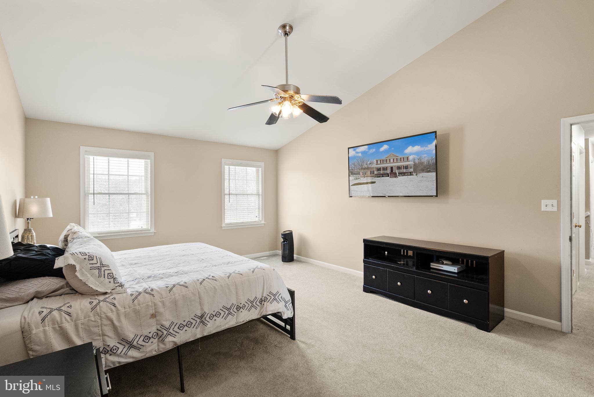 10757 Shenandoah Path Catlett, VA 20119 - Photo 35 of 55 a bedroom with a bed and a chandelier