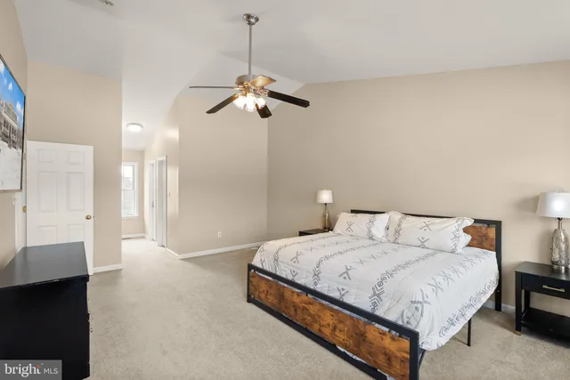 a white bath tub sitting in a bathroom next to a window