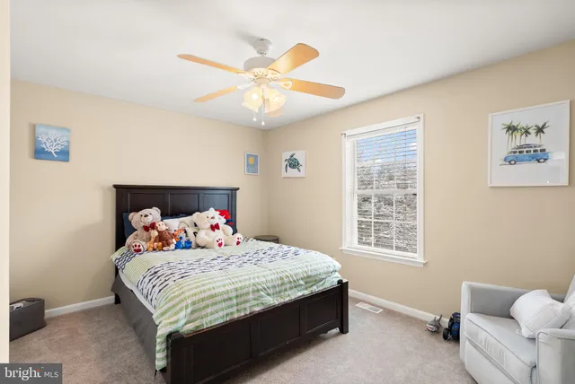 a bedroom with furniture and a chandelier