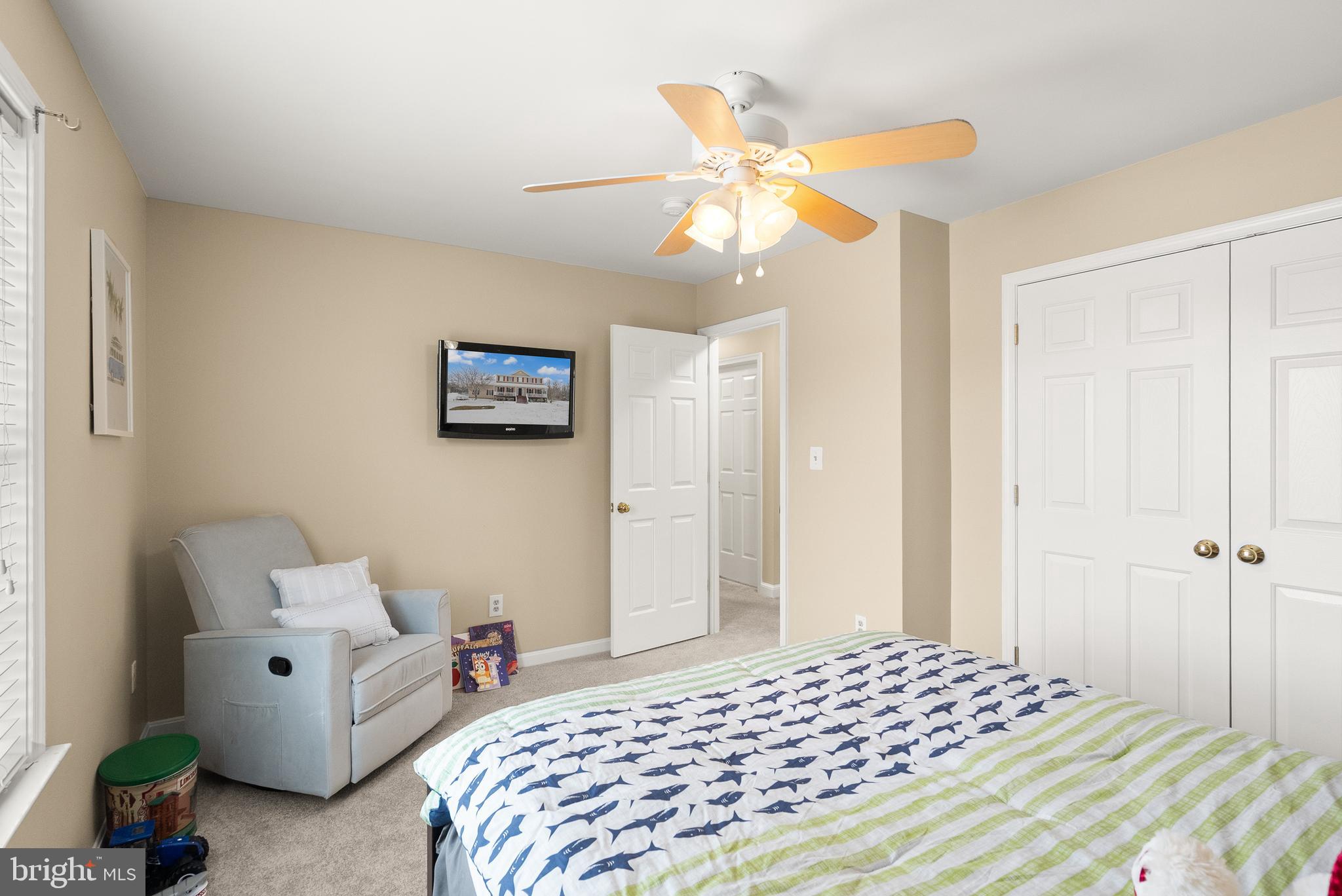 10757 Shenandoah Path Catlett, VA 20119 - Photo 40 of 55 a bedroom with a bed and a chandelier