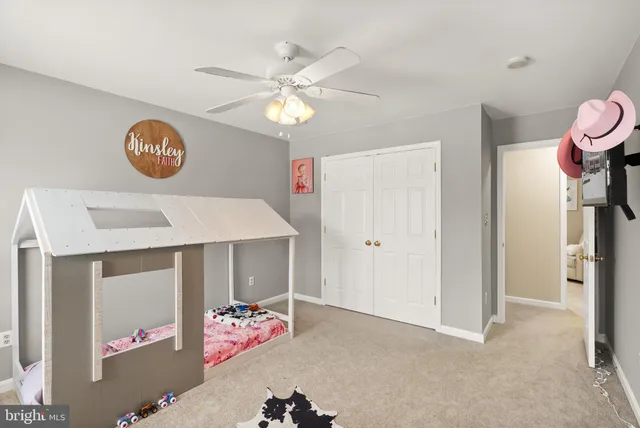 a living room with furniture and toys