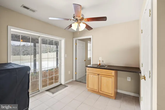 a picture of a wall with a white building